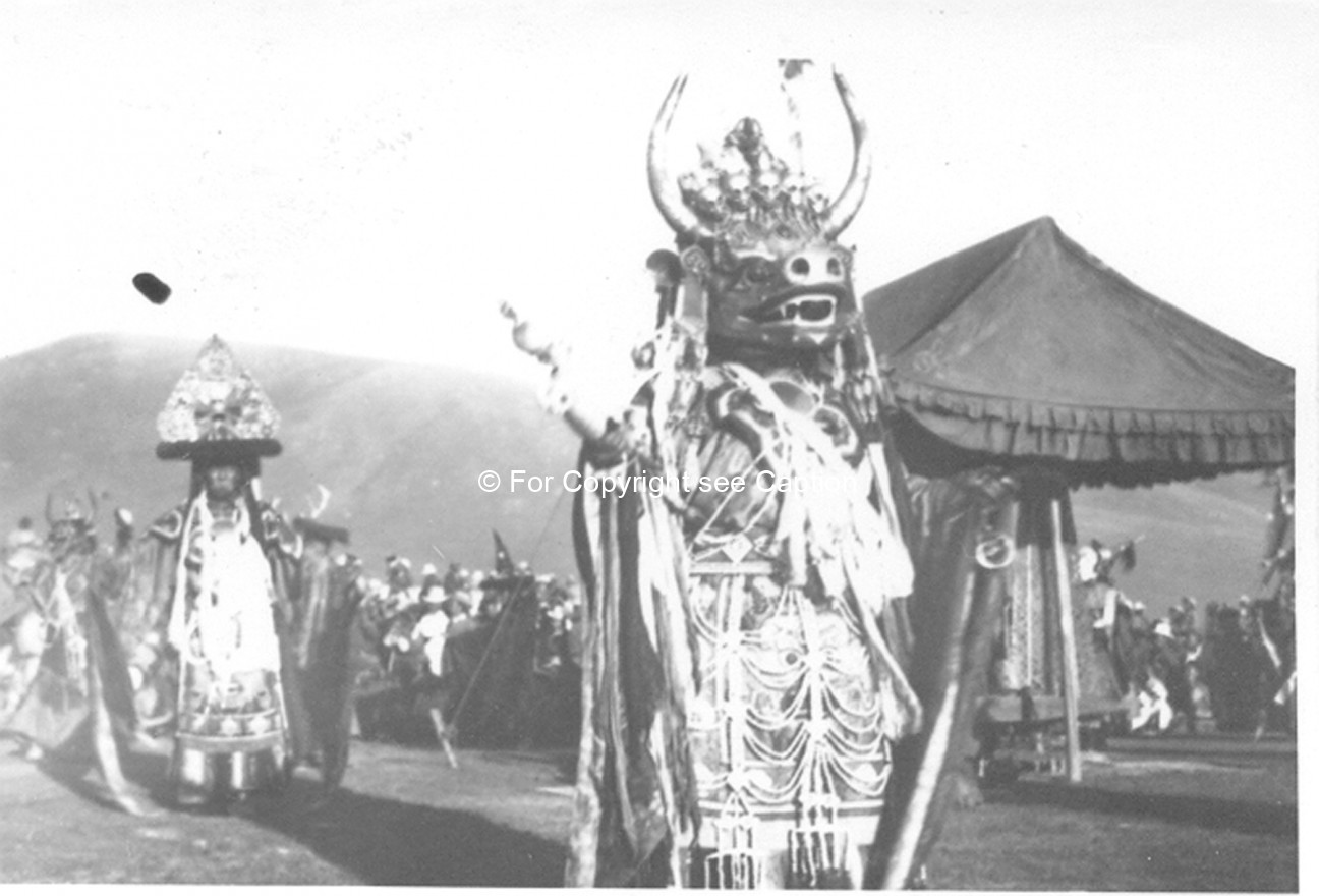 Tsam dance: the Lord of Death (Choijoo) and his escort (Chambon) near the Soriin Asar tent. Film Arc